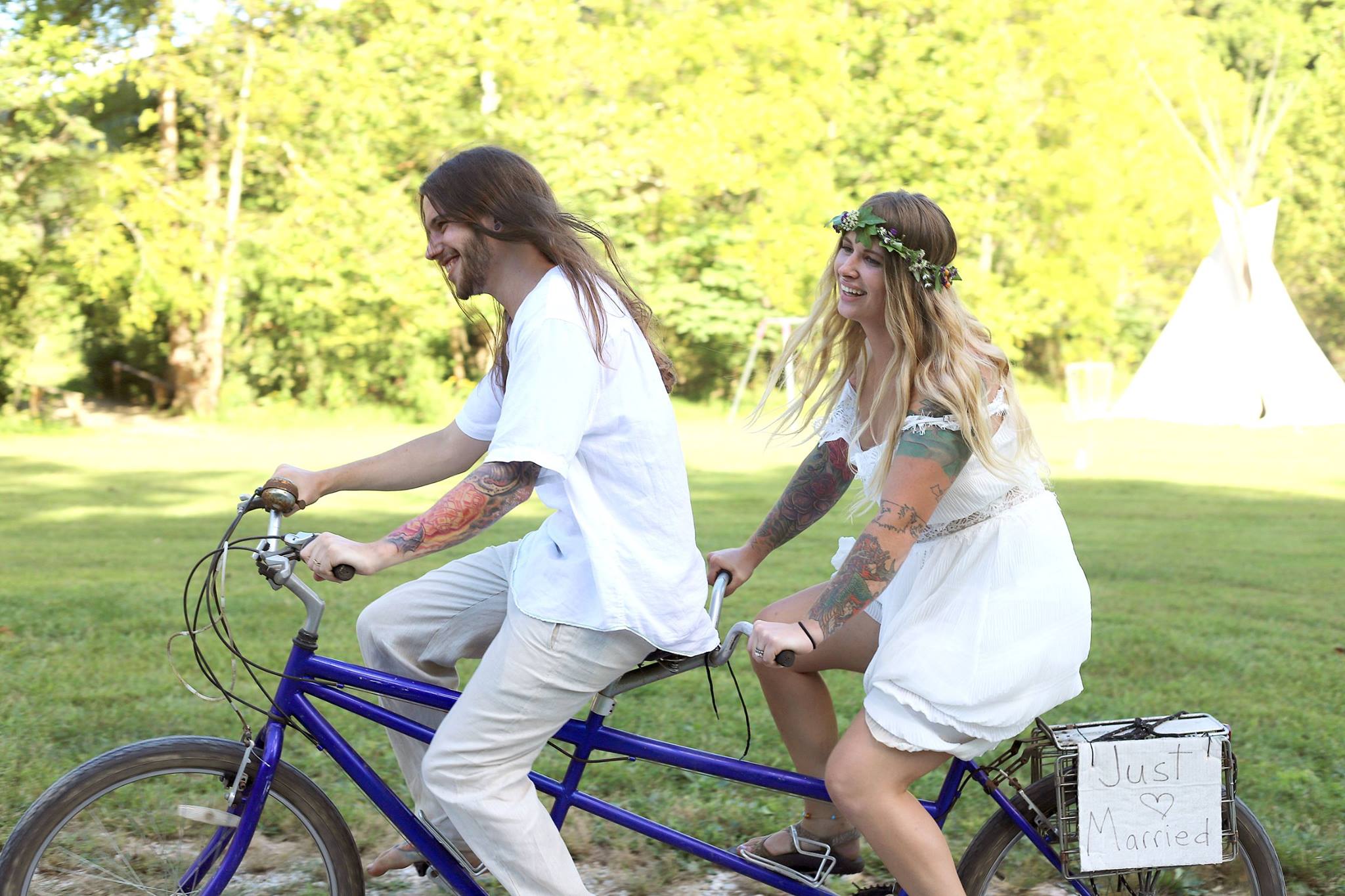 Wedding couple on a tandem bicycle at HomeGrown HideAways Berea Ky